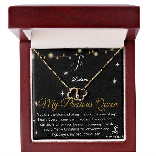 This intricately crafted Precious Queen Holiday Collection is made with 10K solid yellow gold, featuring an infinitely connected pair of hearts that symbolizes your everlasting love for your beloved. Celebrate this special occasion with a timeless keepsake.