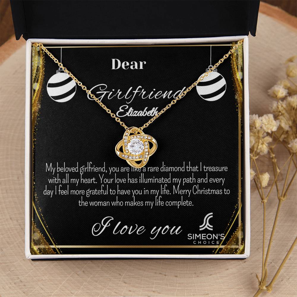 This elegant necklace features a Love Knot pendant that's studded with brilliant diamonds for a luxurious shimmer and customizable jewelry card. Crafted with precious metals, this stunning necklace is the perfect way to express your love.