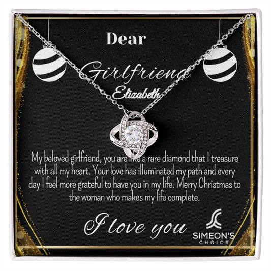 This elegant necklace features a Love Knot pendant that's studded with brilliant diamonds for a luxurious shimmer and customizable jewelry card. Crafted with precious metals, this stunning necklace is the perfect way to express your love.